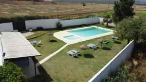 an image of a swimming pool in a yard at Casa Rural La Vega in Antequera