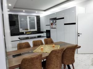 a dining room with a table and chairs at Antonelya Home in Sapanca