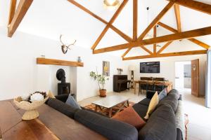 a living room with a couch and a table at The Long Room in Bristol