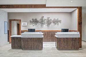 a lobby of a hotel with two reception desks at Courtyard by Marriott Woodland in Woodland