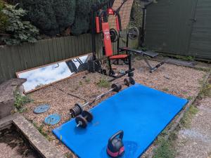 a lawn mower sitting on top of a blue mat at Bramcote House in Bramcote