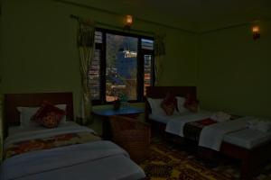 Una cama o camas en una habitación de Hotel Mandala