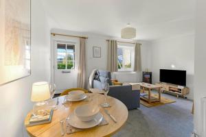 a living room with a table and a couch at 1 Bed in Windermere oc-lr189 in Windermere