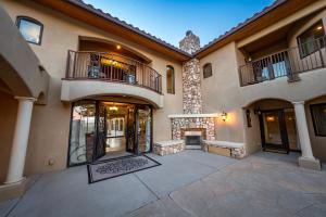 an empty courtyard of a house with a fireplace at Sorelle Vineyard in Cornville