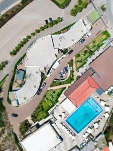 an overhead view of a building with a swimming pool at Mira Palace Hotel in Al Hoceïma