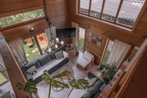 an overhead view of a living room in a cabin at Monte Chalet Kolašin brvnara sa saunom in Kolašin +93 photos