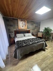a bedroom with a large bed in a room at Hospedaje Shuyen in Victoria