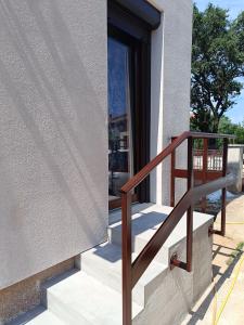 a building with stairs and a glass door at Apartment Hidden Garden in Pula