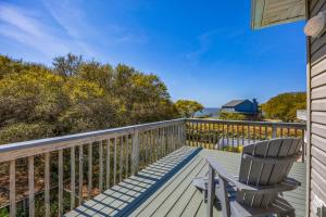 a deck with two chairs sitting on it at 2020 - Merryweather in Sanderling