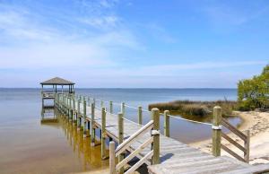 a wooden pier with a gazebo on the beach at 2020 - Merryweather in Sanderling