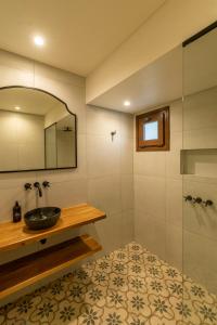 a bathroom with a sink and a shower at Hotel El Candil Tilcara in Tilcara +154 photos