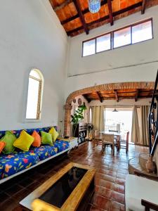 a living room with a couch and a table at Casa Rey Sol Vallarta in Puerto Vallarta +177 photos