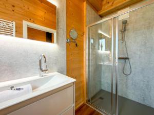 a bathroom with a sink and a shower at Rattendorf 5B in Rattendorf +20 photos