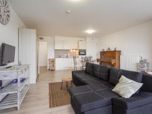 a living room with a couch and a kitchen at B City Complex - 0209 in Blankenberge +4 photos