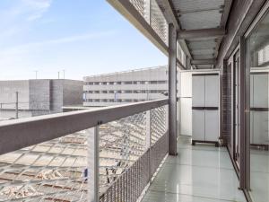 a balcony with a view of a building at B City Complex - 0209 in Blankenberge