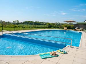 a large swimming pool with a hat on the ground at Nieuwendamme 40C in Lombardsijde