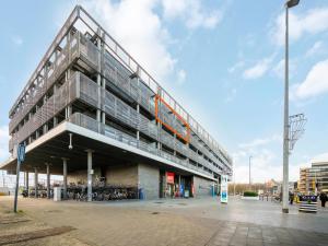 a large building with a staircase on the side of it at B City Complex - 0302 in Blankenberge