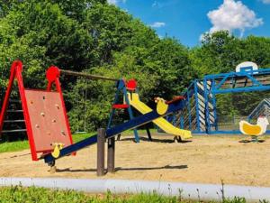 a playground with a slide and a climbing frame at Le Lac Bleu nr 33 in Lacapelle-Marival
