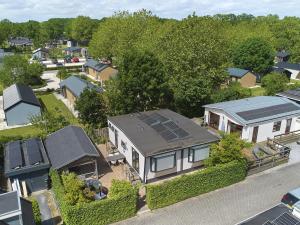 an aerial view of a house with solar panels on its roof at t Kaatsheuveltje 9 in Kaatsheuvel