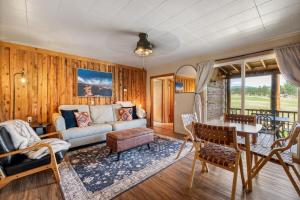 a living room with a couch and a table at Mountain View Gem BHBungalows #2 in Custer