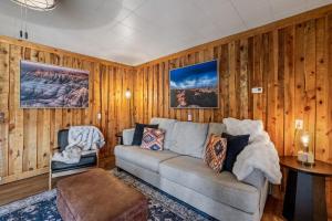 a living room with a couch and a table at Mountain View Gem BHBungalows #2 in Custer