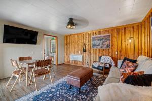 a living room with a table and a couch at Mountain View Gem BHBungalows #2 in Custer +52 photos
