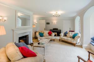 a living room with two couches and a fireplace at 6 Bed in Haslemere oc-c34083 in Haslemere