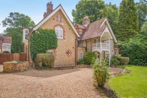 an old brick house with a garden in front of it at 6 Bed in Haslemere oc-c34083 in Haslemere