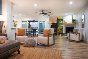 a living room with a couch and chairs and a fireplace at Citrus Grove in Mesa