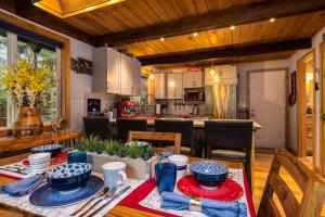 a kitchen and dining room with a table and chairs at On Mountain Time in Glacier