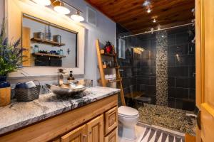 a bathroom with a sink and a shower at On Mountain Time in Glacier +23 photos
