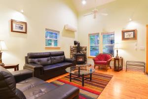 a living room with a couch and a coffee table at Glacier Pines in Glacier