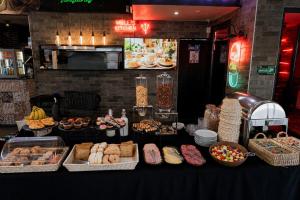 a buffet of food on a table in a restaurant at Hotel Sommelier Agustinas in Santiago