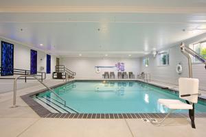 a swimming pool in a hotel room with at Holiday Inn Express Hotel & Suites - Paso Robles by IHG in Paso Robles