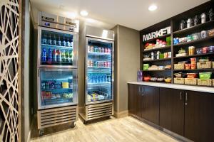 a large refrigerator with its doors open in a kitchen at Holiday Inn Express Hotel & Suites - Paso Robles by IHG in Paso Robles