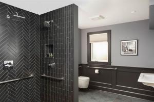 a bathroom with a shower with a toilet and a sink at Shelburne Springs Hotel in Shelburne Falls +24 photos