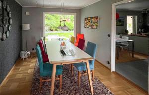 a dining room with a table and chairs at Lovely Home In Simrishamn With Wifi in Simrishamn