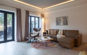 a living room with a couch and a table at Diamond in Binz