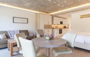 a room with a dining room table and a bedroom at Baltic in Binz