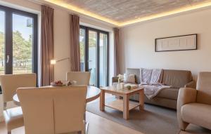 a living room with a couch and a table at Baltic in Binz