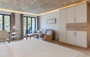 a bedroom with a bed and a living room at Baltic in Binz +35 photos