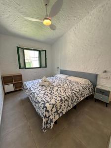 a bedroom with a bed and a ceiling fan at parking terraza jumbo by stay in gran canaria in Playa del Ingles +26 photos