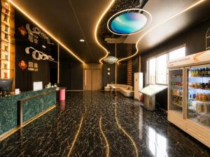 a bar with a black marble floor and a counter at Clover Hotel & Spa in Phnom Penh