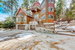 a large wooden house with a large driveway at The Chateau in Lake Arrowhead