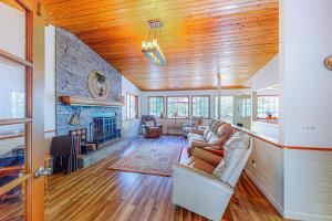 a living room with a couch and a fireplace at Creekside Cabin in Crestline