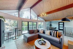 a living room with a couch and a table at The Snow White in Lake Arrowhead