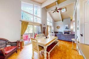 a living room with a table and a couch at Fernrock Cabin in Twin Peaks +24 photos