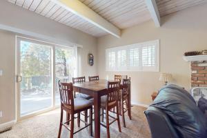 a dining room with a table and chairs at Dancing Bear Chalet in Lake Arrowhead +18 photos