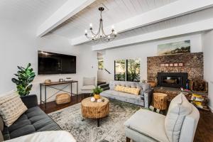 a living room with a couch and a fireplace at Paradise in the Palisades in Lake Arrowhead