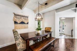 a dining room with a wooden table and chairs at Paradise in the Palisades in Lake Arrowhead +24 photos